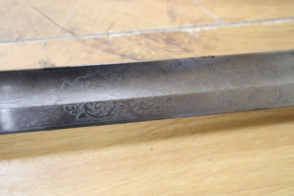 A Victorian officers sword, shagreen grip and 81cm curved, etched, single-edged blade, gilt metal scabbard, inscribed and personalised